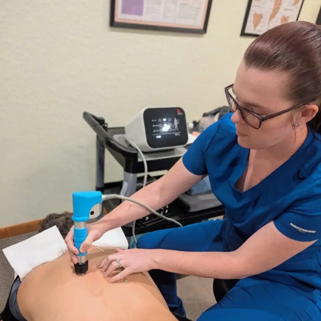 Targeted medical muscle work with a hands-on therapy tool at Spinal Solutions Chiropractic